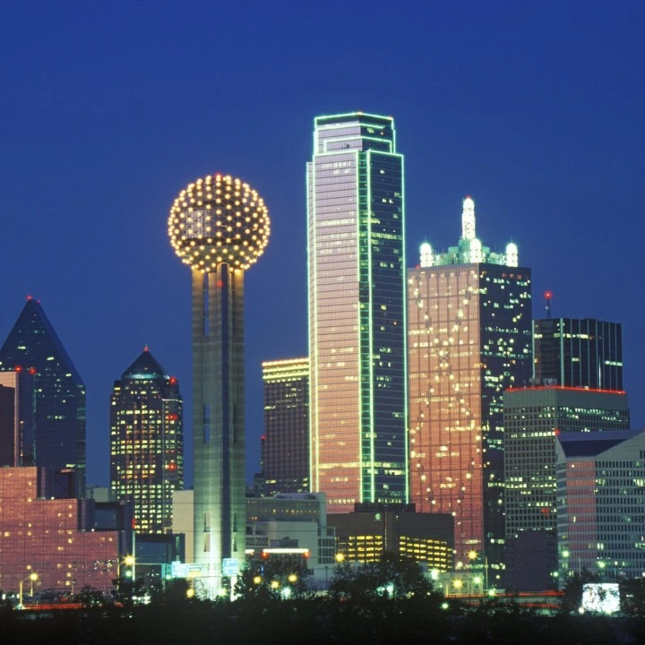 Downtown Dallas, TX skyline at night with Reunion Tower illuminated